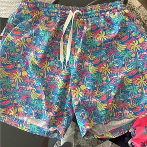 chubbies Tropical Print Swim Trunks in Blue, Yellow, Pink, Green